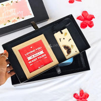 Photo frame and candle included in couple gift hamper