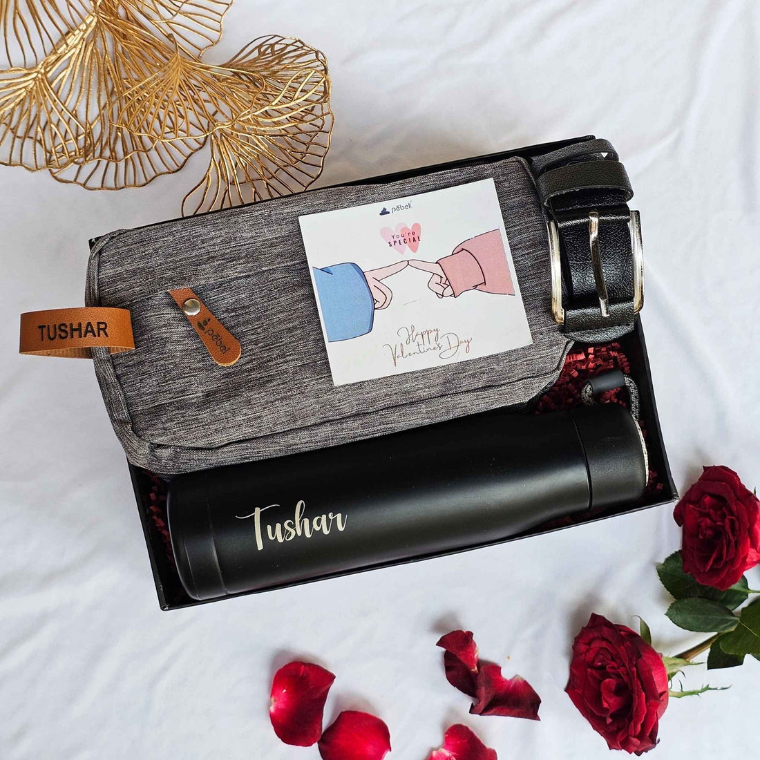 Premium gift box with personalized bottle, shaving pouch, and belt.