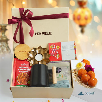 Thoughtful corporate Diwali gift box with healthy snacks, mug, and festive card