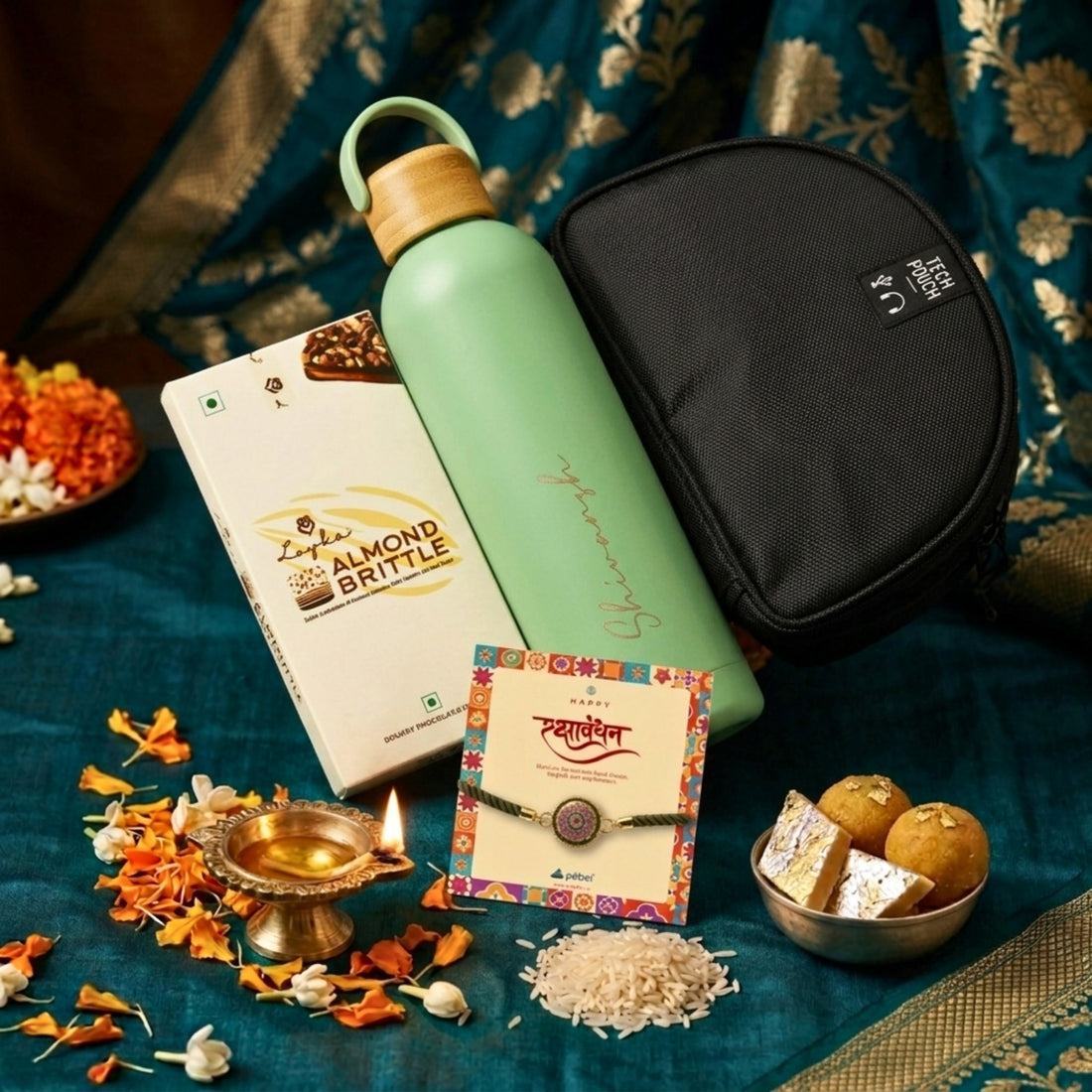 Rakhi hamper for bhai with tech pouch and personalized bottle