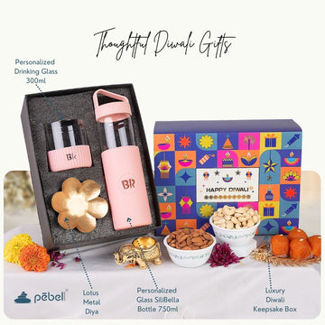 Luxury Diwali gift box with reusable glass bottles, dry fruits, and sweets