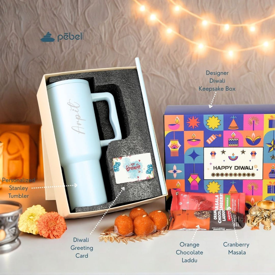 Diwali premium tumbler gift set with orange chocolate ladoos and cranberry munchies