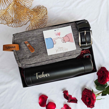 Premium gift box with personalized bottle, shaving pouch, and belt.
